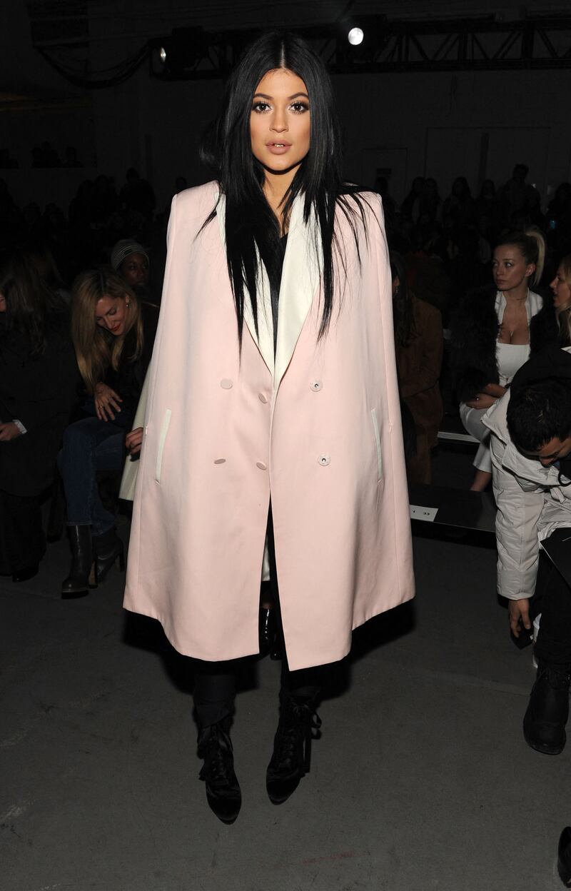 Kylie Jenner, in a blush 3.1 Phillip Lim tuxedo cape, attends the 3.1 Phillip Lim fashion show on February 16, 2015 in New York City. AFP