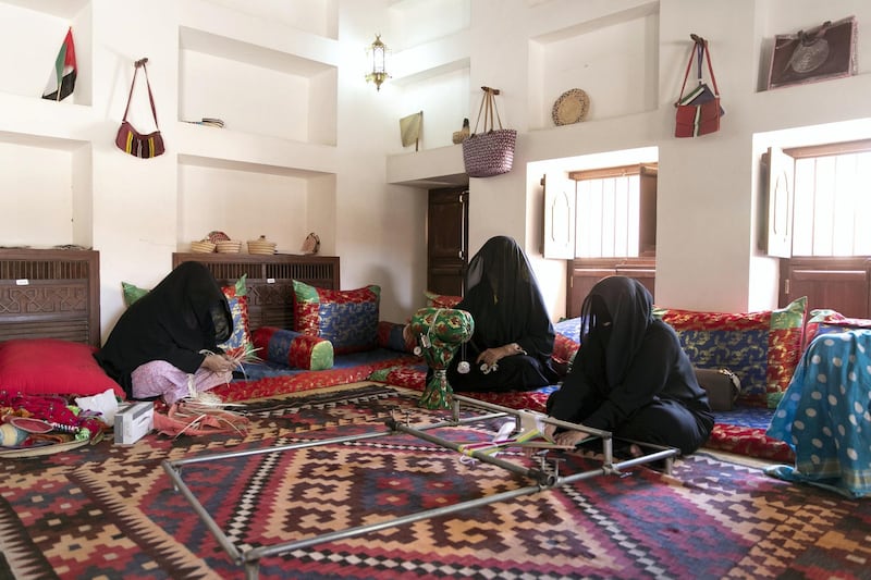 ABU DHABI, UNITED ARAB EMIRATES - JUNE 12, 2018. 

Handicrafts workshop at Al Ain Palace Museum. Running several days a week throughout the year, a group of women teach the community Telli, Khoos, and Sadu.

From left to right, Umm Mohammed Al Mazroui, Umm Rashed, and Umm Mohammed Al Kaabi.

Located on the western edge of Al Ain Oasis, the Palace of the late Sheikh Zayed bin Sultan Al Nahyan was built in 1937. It was converted into a museum in 1998 and opened to the public in 2001. 

(Photo by Reem Mohammed/The National)

Reporter: 
Section: WK
