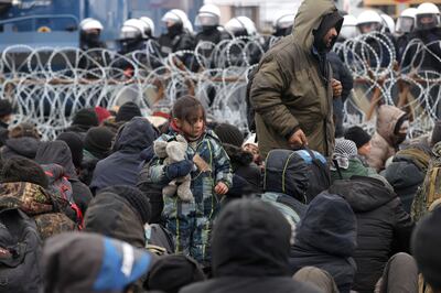 Migrants gather at the Kuznitsa checkpoint near Grodno, Belarus, at the border with Poland. AP Photo