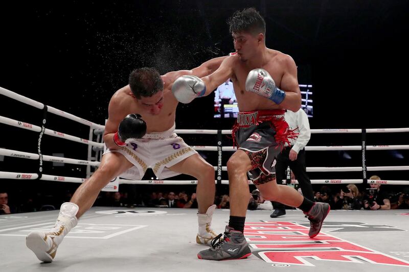 Mikey Garcia, right, goes on the attack against Jessie Vargas. AFP