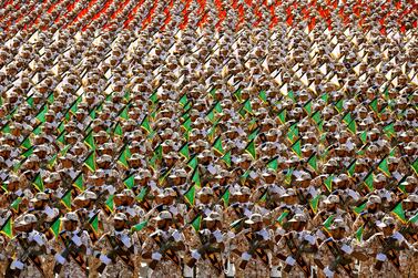In this Sept. 22, 2014 file photo, members of the Iran's Revolutionary Guard march during an annual military parade at the mausoleum of Ayatollah Khomeini, outside Tehran, Iran. AP