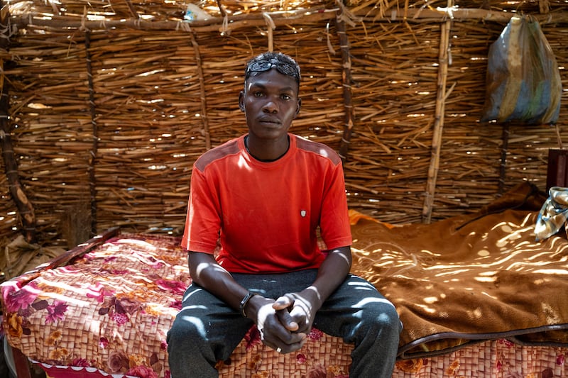Twenty-four-year-old Sudanese refugee Albakir Abbas Ishag poses for a photograph inside his shelter in the Koufroun refugee camp. All photos AFP