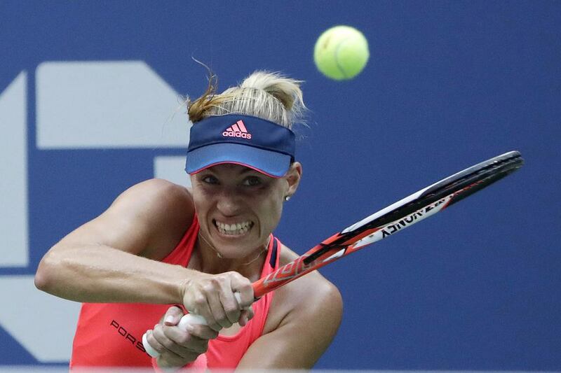 Angelique Kerber of Germany hits a return to Karolina Pliskova. Jason Szenes / EPA