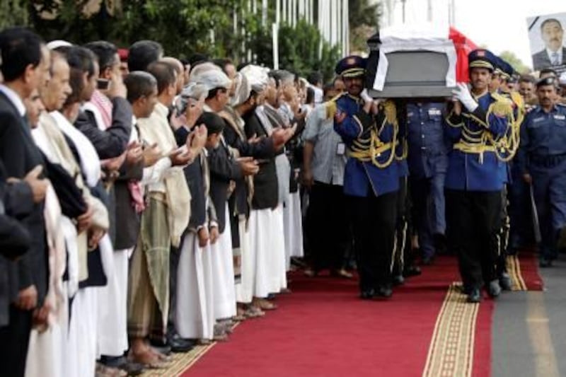 Yemeni honor guards carry the coffin of Chairman of the Shura Council Abdul Aziz Abdul Ghani, who died of injuries sustained in the June 3, 2011 attack on Yemeni President Ali Abdullah Saleh's compound, as Yemeni officials attend his funeral procession in Sanaa, Yemen, Tuesday, Aug. 23, 2011. (AP Photo/Hani Mohammed) *** Local Caption ***  Mideast Yemen.JPEG-041fe.jpg