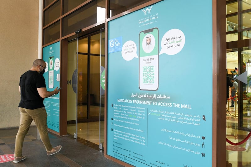 New Covid Restrictions-AD Signage regarding new mandatory entrance procedures at Khalidiyah Mall on June 15, 2021. Khushnum Bhandari/ The National
Reporter: Haneen Dajani News