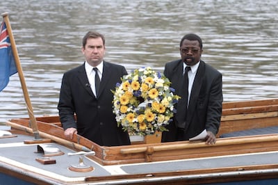 Detective Inspector Will O'Reilly and John Azah, for the police's independent advisory group, lay a wreath on the River Thames close to where the body of Adam was found. Alamy