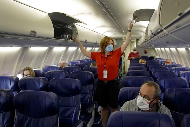 Federal officials are extending into January a mandate requiring people on flights and public transport wear face masks to limit the spread of Covid-19.  AP