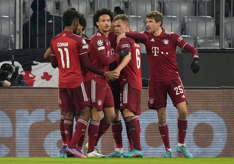 Bayern's Robert Lewandowski is congratulated by teammates after the first goal. AP