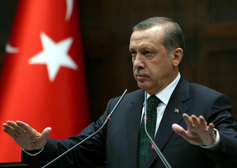 (FILES) In this file photo taken on June 11, 2013 Turkey's Prime Minister Recep Tayyip Erdogan addresses members of parliament from his ruling AK Party (AKP) during a meeting at the Turkish parliament in Ankara. President Recep Tayyip Erdogan on July 9, 2018 is to be sworn in for his second term as head of state, taking on greater powers than any Turkish leader for decades under a new system condemned by opponents as autocratic. The president will sit at the top of a vertical power structure marked by a slimmed-down government with 16 ministries instead of 26 and multiple bodies reporting to him. / AFP / Adem ALTAN
