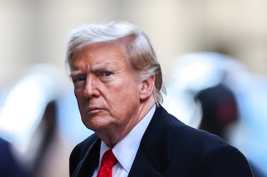 Former US President Donald Trump arrives at 40 Wall Street after his court hearing to determine the date of his trial for allegedly covering up hush money payments linked to extramarital affairs in New York City on March 25, 2024.  Trump faces twin legal crises today in New York, where he could see the possible seizure of his storied properties over a massive fine as he separately fights to delay a criminal trial even further.  (Photo by Charly TRIBALLEAU  /  AFP)