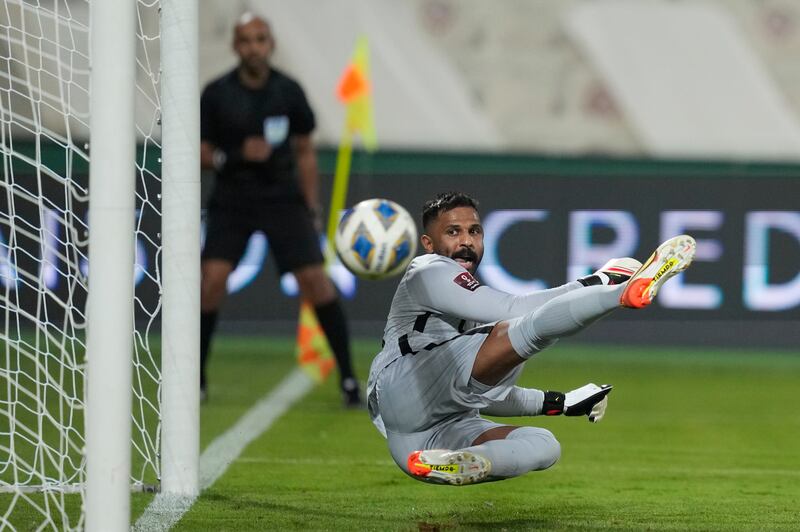 Saudi Arabia goalkeeper Mohammed Alowais fails to stop Zhu Chenjie's penalty. AP