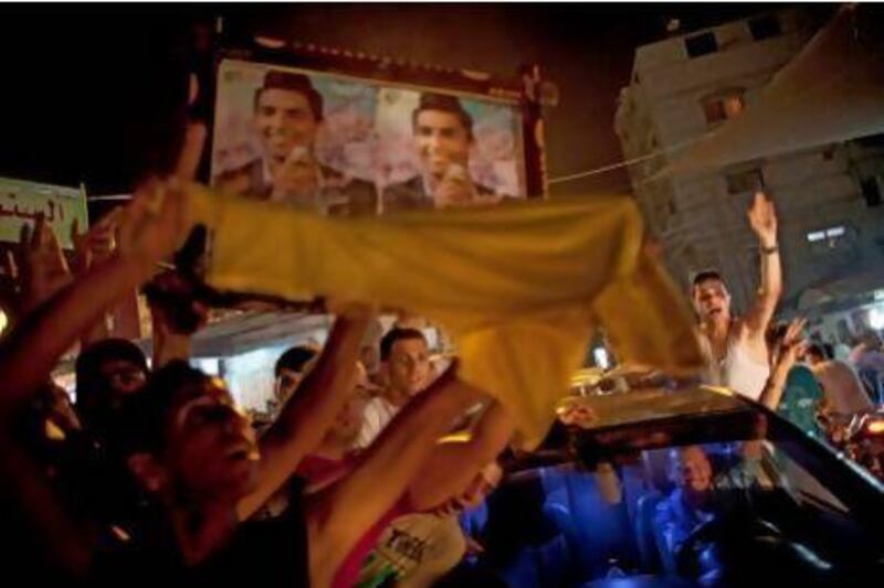 Palestinians react to the news that Mohammed Assaf is the winner of the regional 'Arab Idol' singing contest.