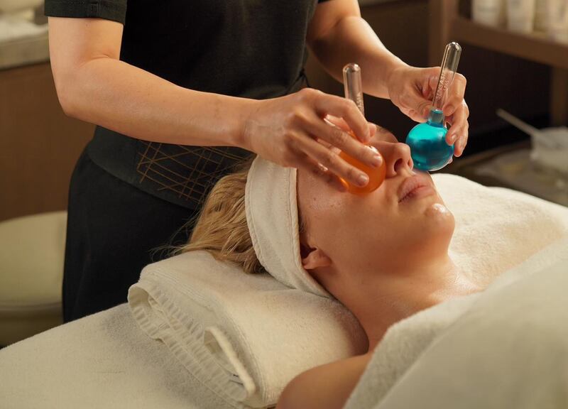 A face massage with ice globes can help revive the skin. Photo: SensAsia Spa
