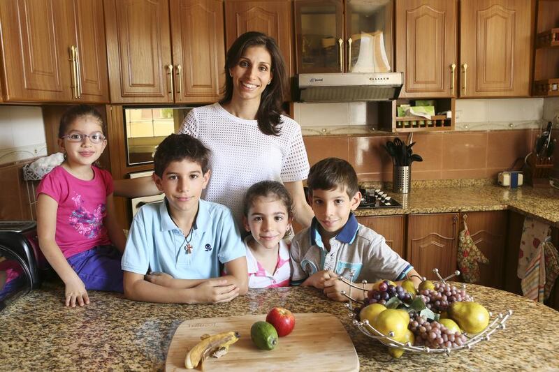 Bernadette Abraham, a nutritional therapist and mother of four – from left, Isabella, Theodore, Vanessa and Vincent – says blending healthy foods with others they enjoy encourages children to eat healthier, as does cooking and eating together as a family. Sarah Dea / The National.