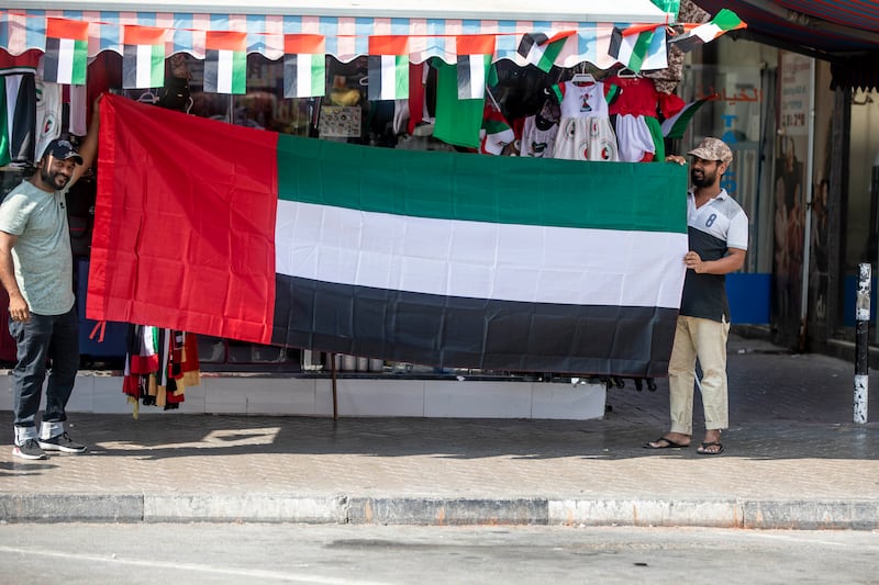 Vendors selling flags and other related items in Satwa, Dubai to celebrate flag day. Ruel Pableo / The National