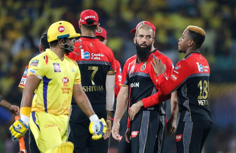 Royal Challengers Bangalore's Moeen Ali, second right, celebrates with teammates the dismissal of Chennai Super Kings' Suresh Raina, left, during the VIVO IPL T20 cricket match between Chennai Super Kings and Royal Challengers Bangalore in Chennai, India. AP Photo