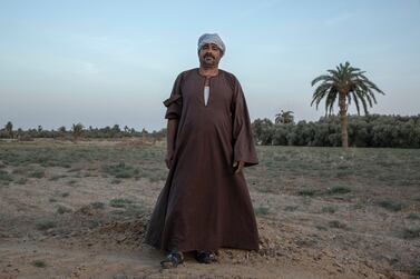 55-year-old Egyptian farmer Makhluf Abu Kassem, stands on a land that was once fertile, in Second Village, Qouta town, Fayoum, Egypt, Saturday, Aug. 8, 2020. Abu Kassem fears that a dam Ethiopia is building on the Blue Nile, the Nile's main tributary, could add to the severe water shortages already hitting his village if no deal is struck to ensure a continued flow of water. "The dam means our death," he said. (AP Photo/Nariman El-Mofty)