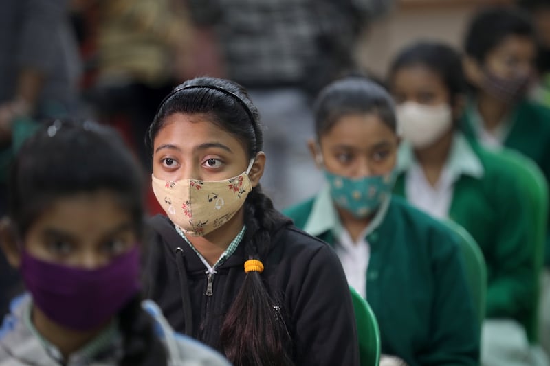 Indian students visit their school for a COVID-19 vaccine dose in Kolkata Eastern India.  Indian government announced a Covid-19 vaccine drive for students aged 15 to 18 at their schools from 03 January 2022.   EPA