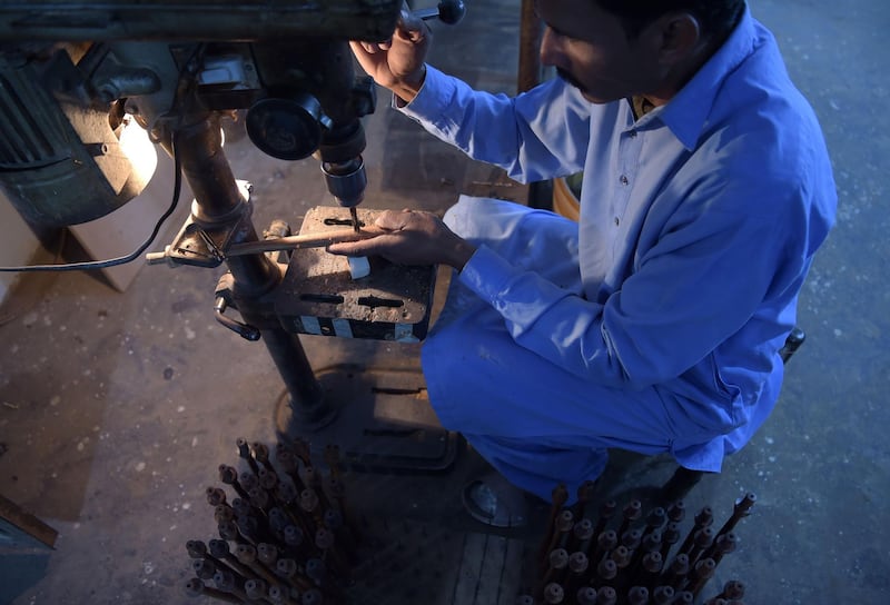 Umer Farooq is the third generation to take up the bagpipe-making tradition in Pakistan, which is thousands of kilometres from Scotland yet sells thousands of bagpipes each year. AFP.