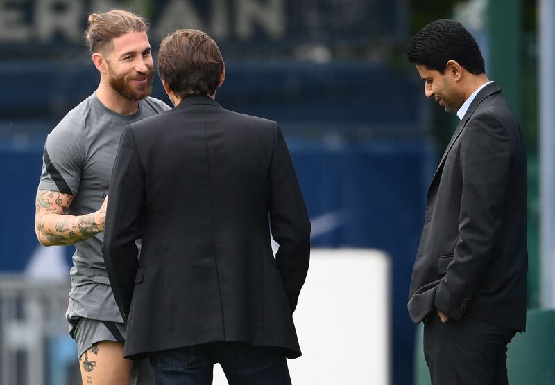 Sergio Ramos with PSG's sporting director Leonardo, centre, and president Nasser Al-Khelaifi. AFP