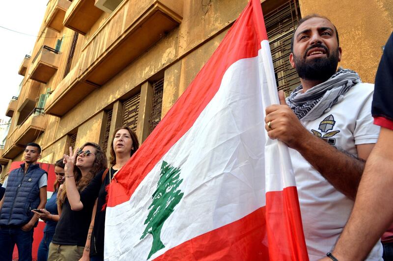 Protesters shout slogans in front of the Lebanese Minister of Telecommunications Mohammad Choucair's house during ongoing anti-government in Beirut. EPA