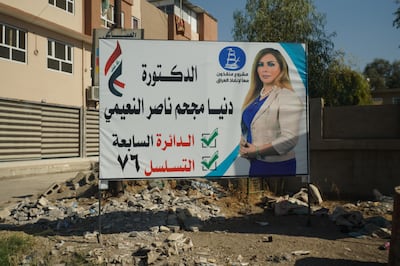 A campaign poster for Dr Dunia Al Naemi, who gave up her job in London to stand for election in her native Mosul. Mahmoud Ridha / The National