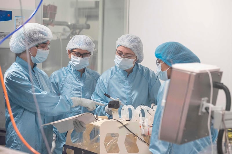 Technicians work at Oxford BioMedica. AFP