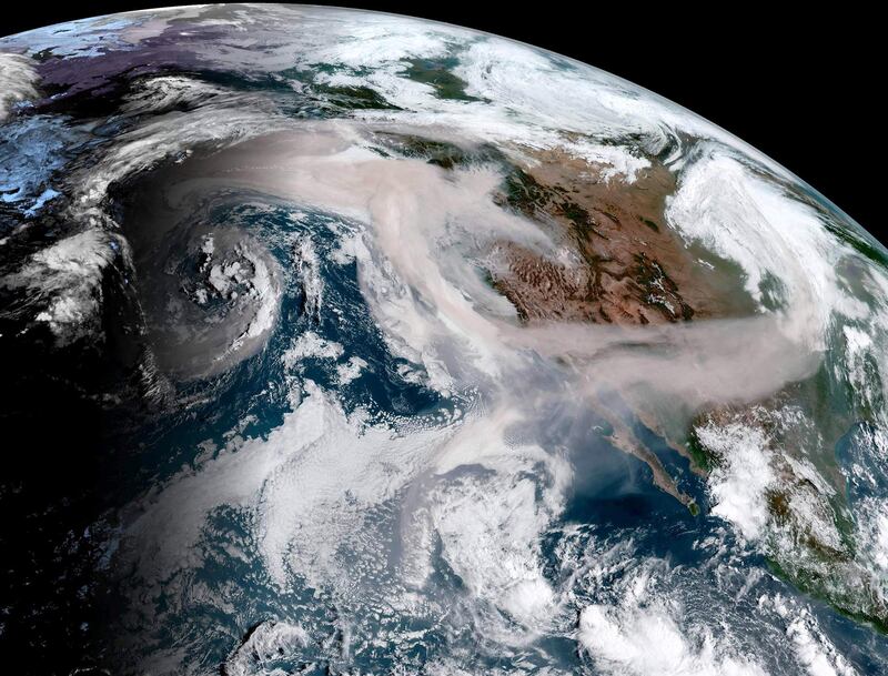 This September 12, 2020, image obtained from the National Oceanic and Atmospheric Administration (NOAA) shows smoke from Oregon and California wildfires moving west, south and east at 16H00UTC. US officials girded Saturday for the possibility of mass fatalities from raging wildfires up and down the West Coast, as evacuees recounted the pain of leaving everything behind in the face of fast-moving flames. There were 16 deaths confirmed this week, with wide stretches of land still cut off by flames fueled by tinder-dry conditions of the kind caused by climate change. - RESTRICTED TO EDITORIAL USE - MANDATORY CREDIT "AFP PHOTO / NOAA/GOES" - NO MARKETING - NO ADVERTISING CAMPAIGNS - DISTRIBUTED AS A SERVICE TO CLIENTS
 / AFP / NOAA/GOES / - / RESTRICTED TO EDITORIAL USE - MANDATORY CREDIT "AFP PHOTO / NOAA/GOES" - NO MARKETING - NO ADVERTISING CAMPAIGNS - DISTRIBUTED AS A SERVICE TO CLIENTS
