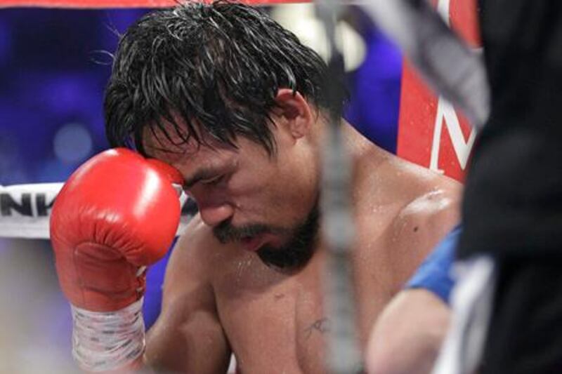 Manny Pacquiao, from the Philippines, sits in his corner following the tenth round of his WBO welterweight title fight against Timothy Bradley, from Palm Springs, Calif., Saturday, June 9, 2012, in Las Vegas. Bradley won the bout by split decision. (AP Photo/Julie Jacobson)
