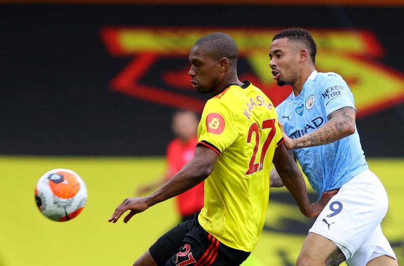 Manchester City's Gabriel Jesus, right, duels for the ball with Watford's Christian Kabasele. AP