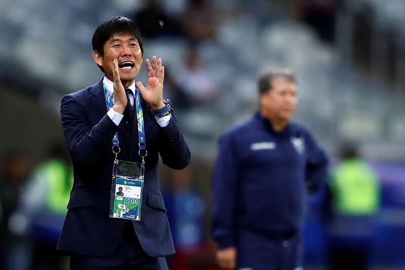 Japan manager Hijame Moriyasu shouts instructions to his team. EPA