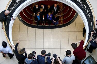 The 11 MPs who rebelled against their parties pose for pictures at the launch of their group in February. Reuters