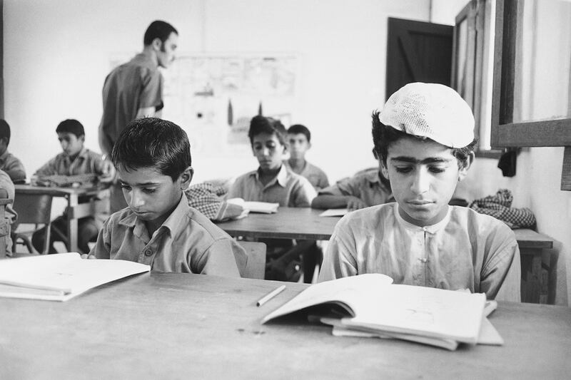 A primary school class at headquarters camp of the Trucial Oman Scouts in Sharjah, United Arab Emirates in November 1971. Education is the prime endeavor of all Trucial States. Teachers are brought in from Egypt, Iran, and from among Palestinians.  (AP Photo/Horst Faas)