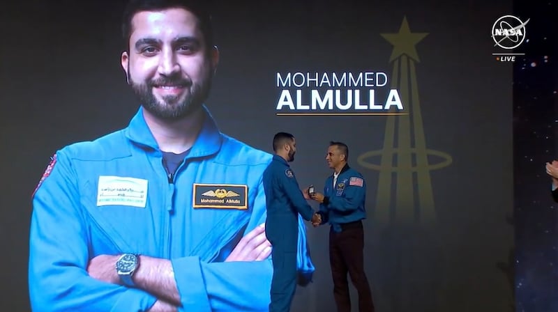 Mr Al Mulla receives his silver astronaut pin. Photo: Nasa TV