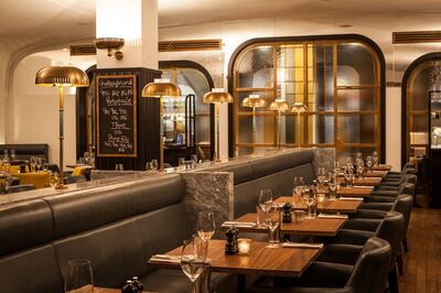 The restaurant is done up with wood-panelled walls and leather banquettes. Photo: Hawksmoor Group