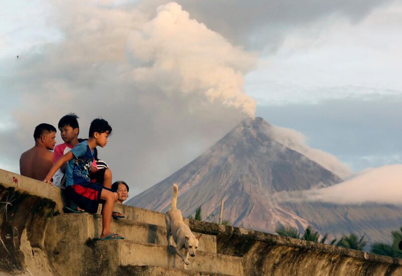Filipino villagers view Mount Mayon erupting  in Legaspi city, Albay province, Philippines. Francis R Malasig / EPA