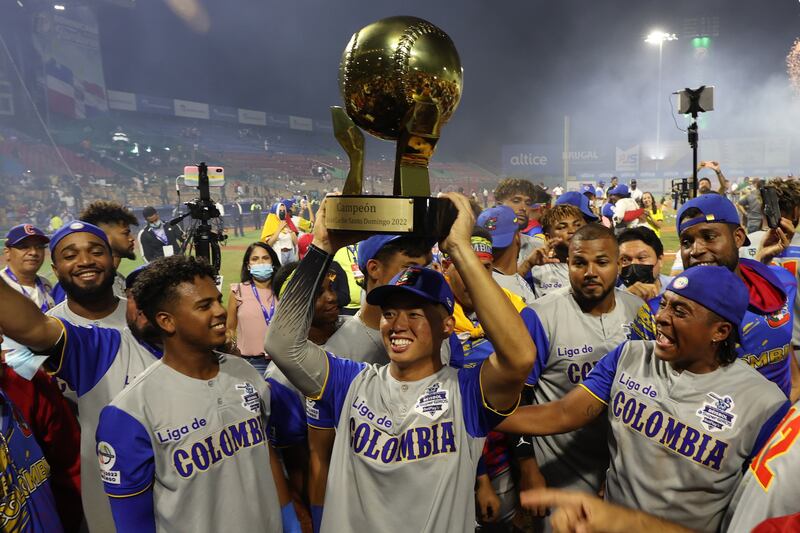 Taiwanese baseball player Tsung Cheng Chen, centre, of Caimanes, celebrates with the trophy after winning the final of the 2022 Caribbean Series between Caimanes de Barranquilla of Colombia and the Gigantes del Cibao of the Dominican Republic, in Santo Domingo, Dominican Republic. EPA