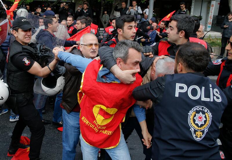 Police scuffle with demonstrators during May Day protests in Istanbul. Lefteris Pitarakis / AP Photo