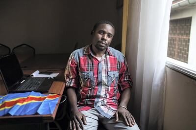 Gloire Watshipa, co-founder and coordinator of the pro-democracy youth movement Cocorico, in the room he uses as an office in Kinshasa, DRC, Aug. 15, 2018.