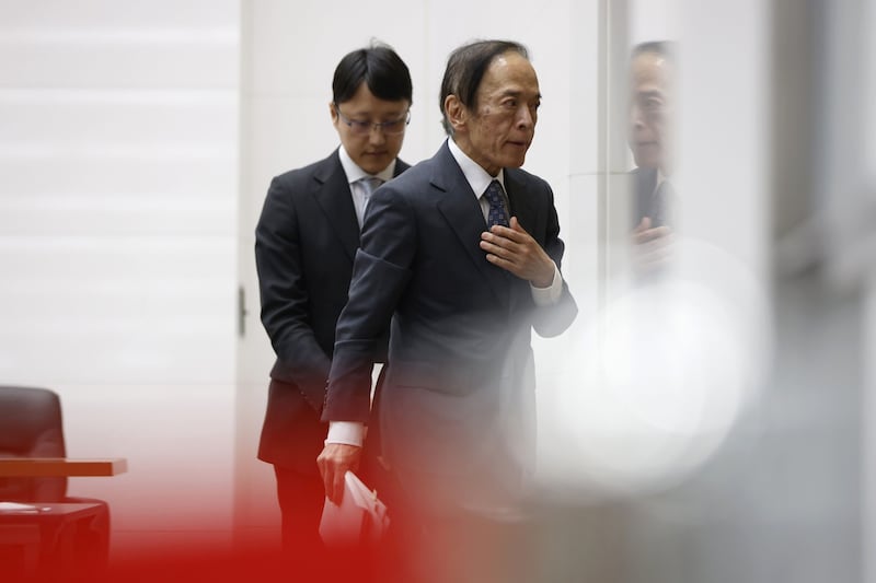 Kazuo Ueda, governor of the Bank of Japan leaves a news conference at the central bank's headquarters in Tokyo, on Friday. The Bank of Japan continued to defy global central bank trends by sticking with stimulus as it waits for signs of more sustainable inflation while its peers signal the need to raise interest rates further to rein in prices. Bloomberg