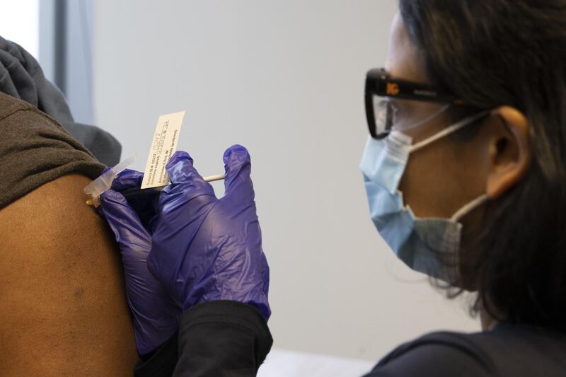 SEATTLE, WA - FEBRUARY 12: A patient receives his second dose of the Novavax Covid-19 vaccine during the phase 3 clinical trial at the UW Virology Research Clinic on February 12, 2021 in Seattle, Washington. The Novavax vaccine requires standard refrigeration temperatures (2 to 8°C) making it easier to store and distribute than those requiring ultra-freezing temperatures. UW Medicine got its first shipment of samples for the clinical trials in January coming from clinics all over the United States and Mexico.   Karen Ducey/Getty Images/AFP
== FOR NEWSPAPERS, INTERNET, TELCOS & TELEVISION USE ONLY ==
