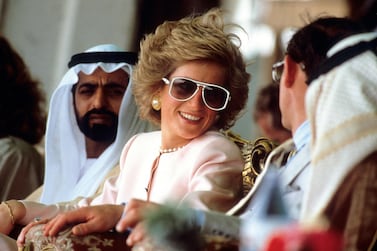 Diana, Princess of Wales and Prince Charles, Prince of Wales watch camel racing during a visit to Abu Dhabi, UAE in March 1989. On left is Sheikh Nahayan & on right (back to camera) is Sheikh Tahnoun. Photo: Anwar Hussein