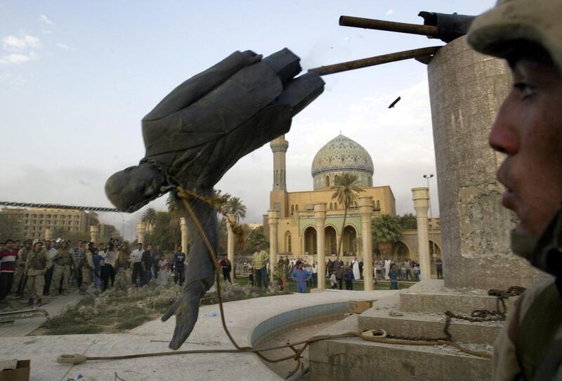 Iraqis and US forces topple the statue of Saddam Hussein in Firdos Square, Baghdad, in April 2003. The Good Lieutenant is set against the backdrop of the US invasion of the country. Jerome Delay / AP Photo 