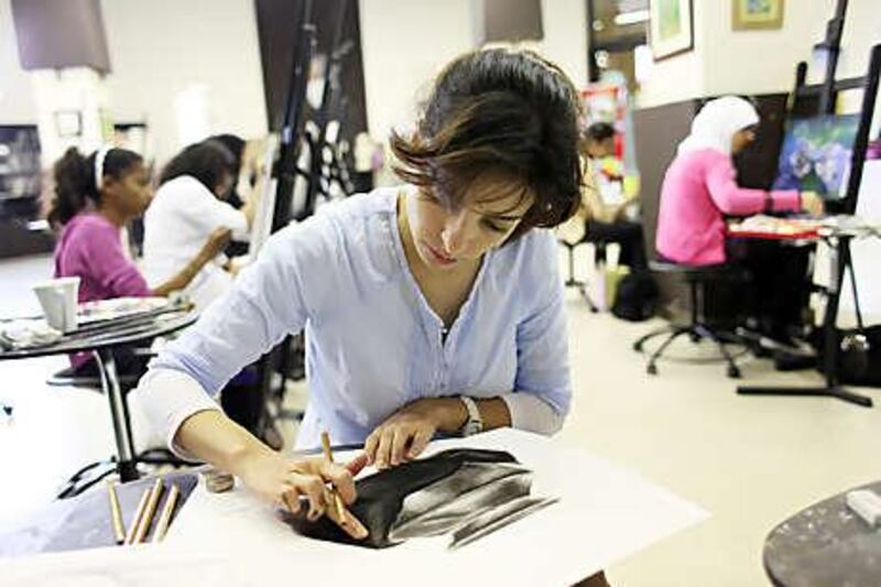 Diana Darouiche works on a charcoal drawing during one of a recent Art Workshop classes at the National Theatre in Abu Dhabi.