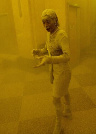 A woman is covered in dust following the collapse of the World Trade Center. AFP