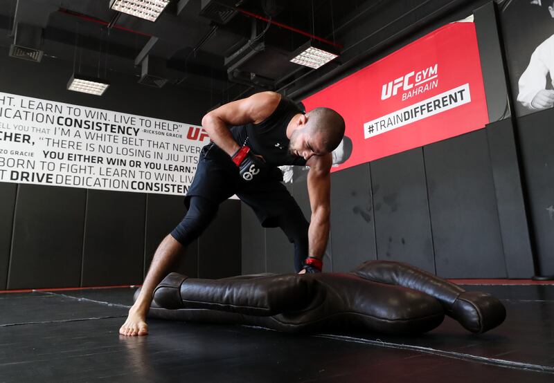 Before the session is out, Muhammad Mokaev straddles a grappling dummy, honing some ground-and-pound that would make human eyes water.