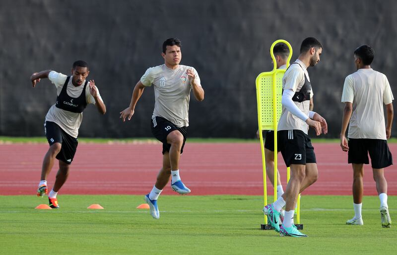 Fabio de Lima, centre, warms up during a UAE training session.