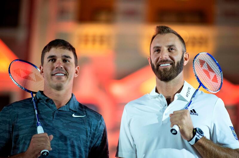 Brooks Koepka (L) of the United States and Dustin Johnson of the United States pose ahead of the World Golf Championships-HSBC Champions golf tournament in Shanghai on October 23, 2018. / AFP / JOHANNES EISELE
