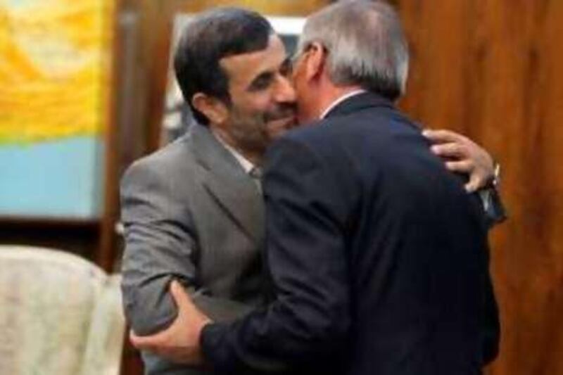 Iranian President Mahmoud Ahmadinejad (L) greets Lebanese Foreign Minister Ali al-Shami prior to a meeting in Tehran on August 8, 2010, as the latter begins an official visit to Iran. AFP PHOTO/STR *** Local Caption ***  155614-01-08.jpg