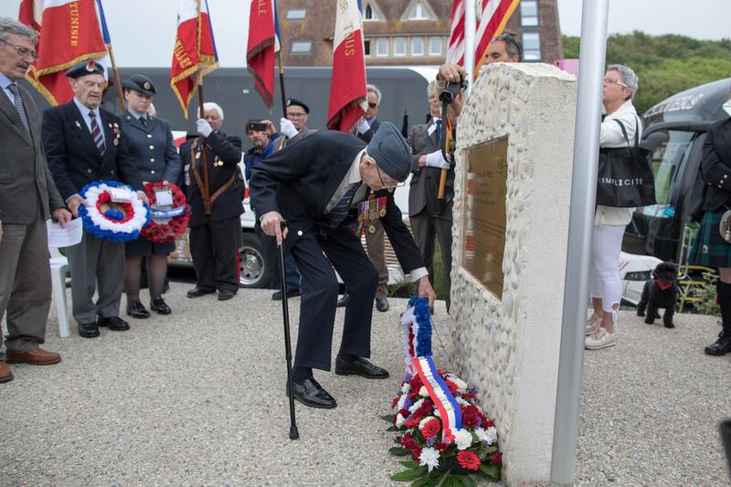 Lesley George Robinson, 98, the last survivor of the RAF veterans who landed at Omaha Beach lays a wreath at Vierville-sur-Mer in Normandy, France.